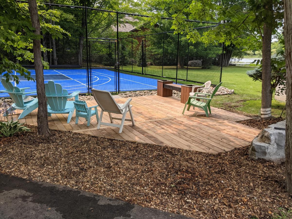 Custom deck and basketball court built in Buckhorn by Cottage Life Care