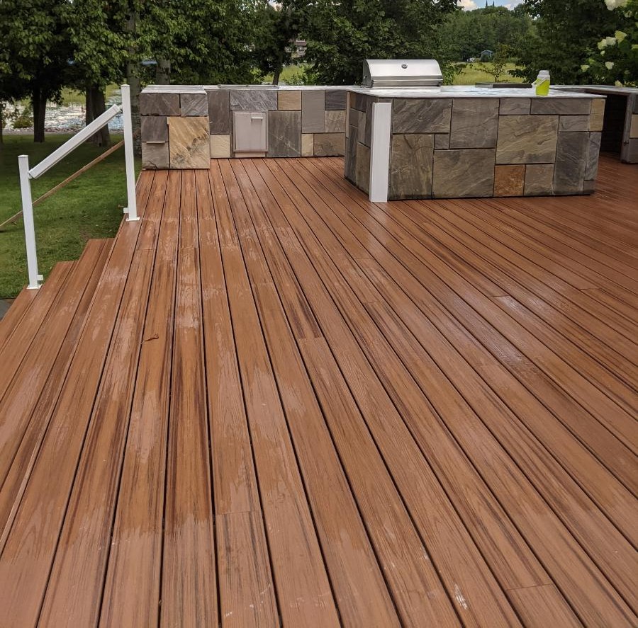 Trex composite deck with built-in outdoor kitchen and stainless grill, Buckhorn