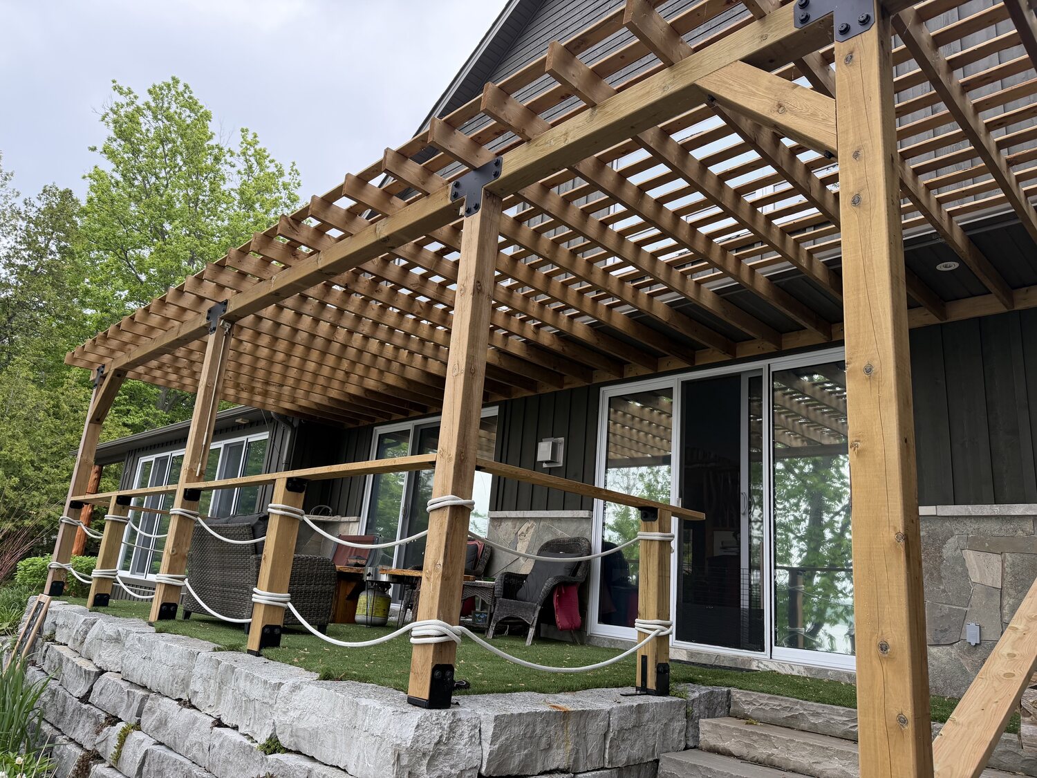 Cedar pergola and shade structure beside the home, Chemong Lake
