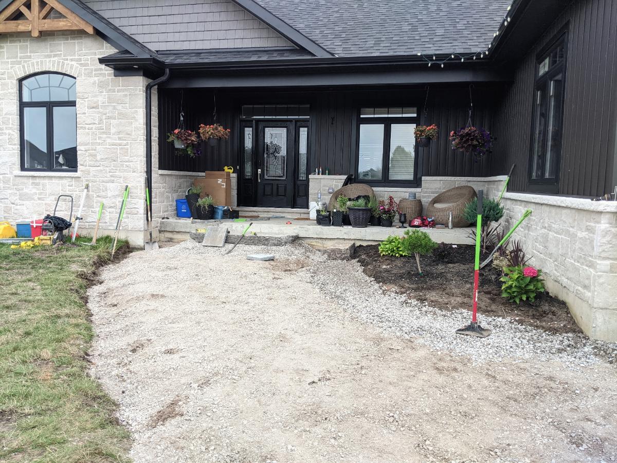 Walkway at a Pigeon Lake property before paver installation